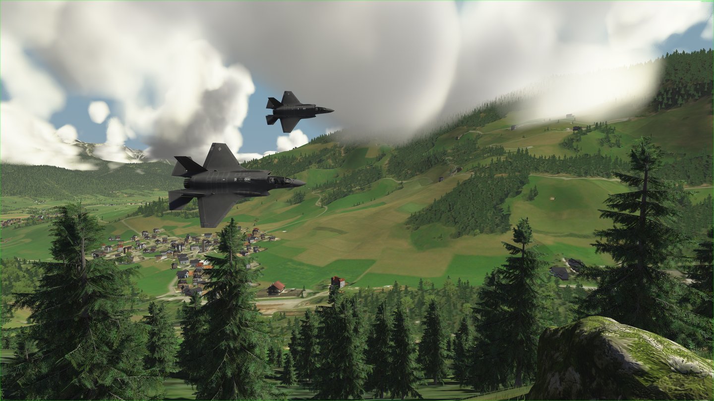 Two F-35 fighters at low level over an alpine valley, rendered in the d-World synthetic environment